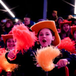 A group of athletes competing in athletic event sports