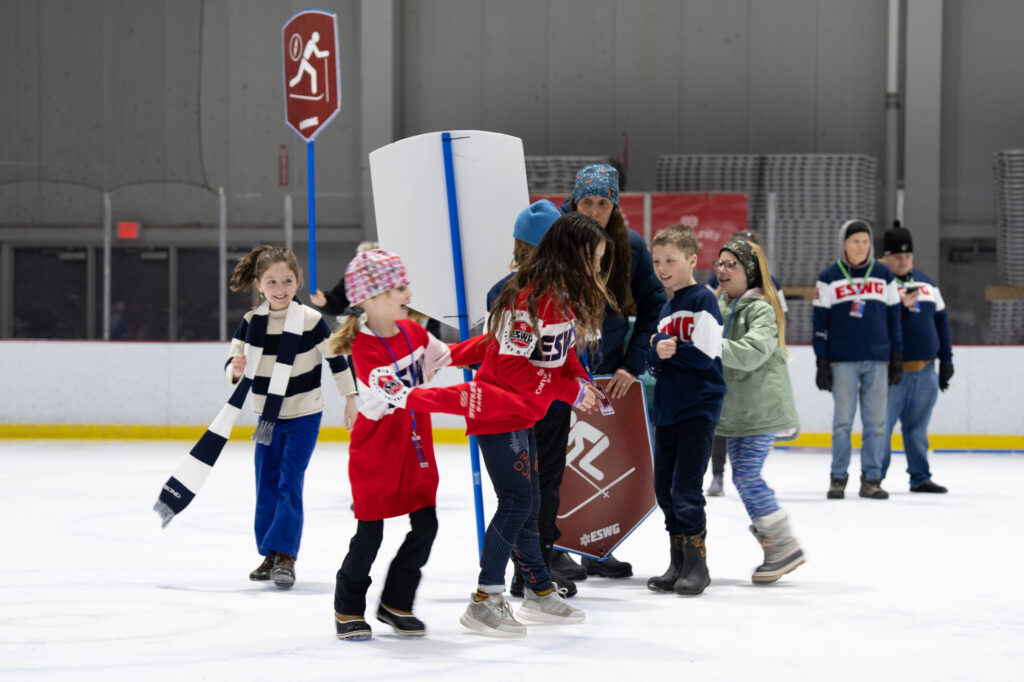 A group of athletes skating on the rink
