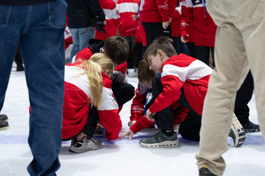 A group of athletes competing in athletic event sports