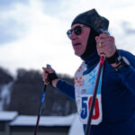 Two athletes competing in athletic event sports outdoors