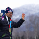 An athlete competing in athletic event sports