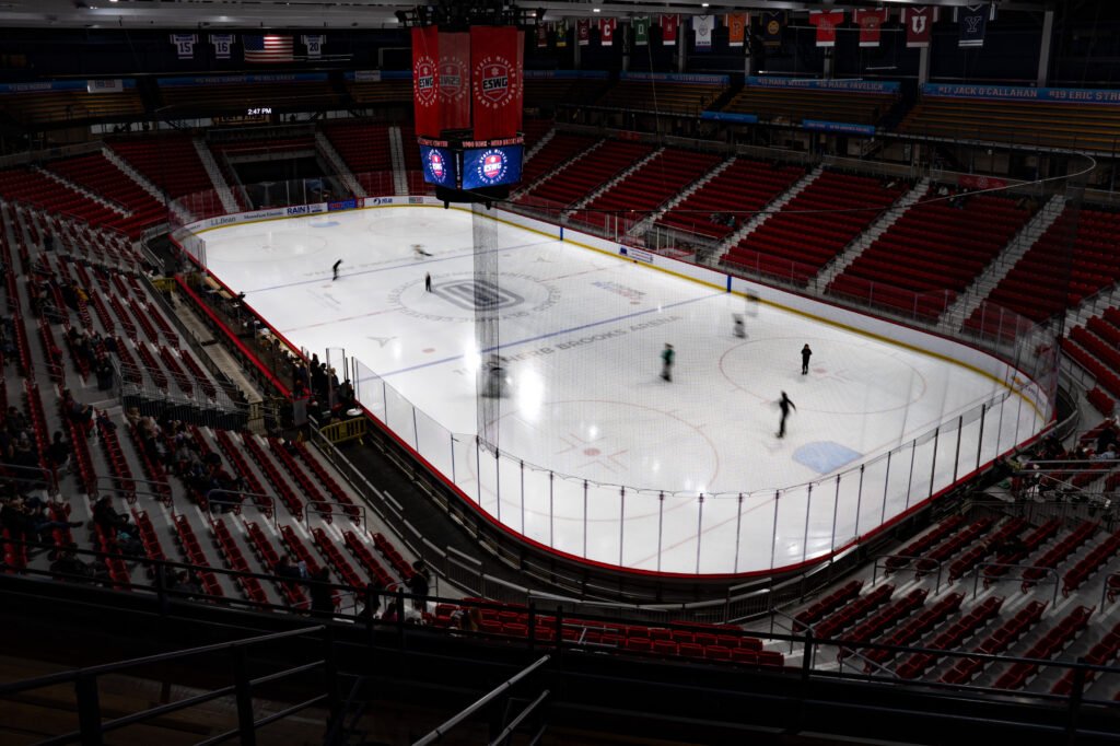 A group of athletes skating on the rink