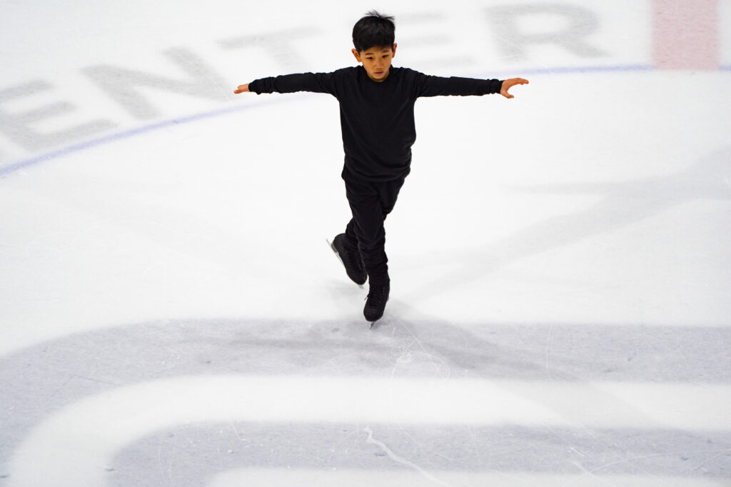 An athlete skating on the rink