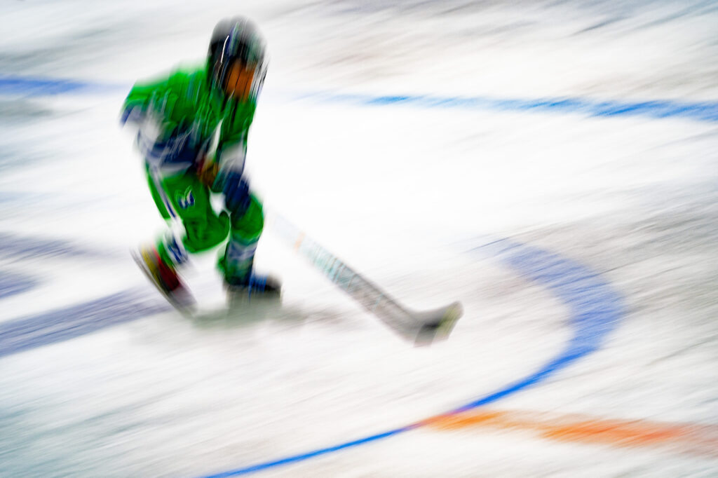 An athlete competing in athletic event sports with helmet
