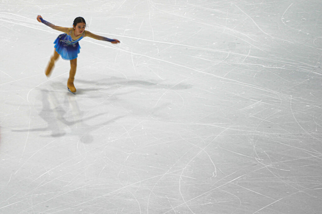 An athlete skating on the rink