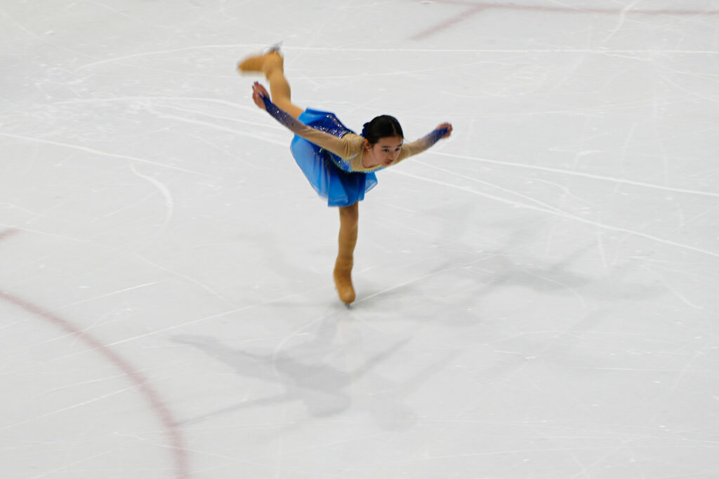 An athlete skating on the rink