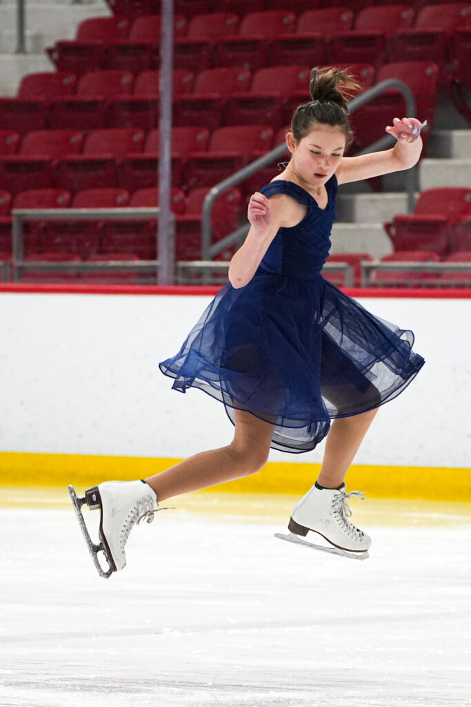 An athlete skating on the rink