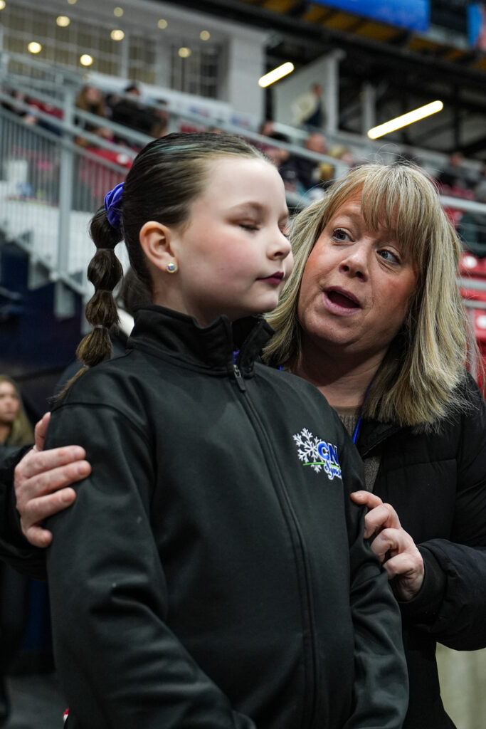 A group of athletes competing in athletic event sports