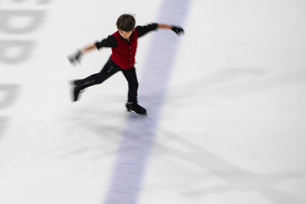 An athlete skating on the rink