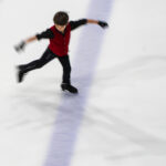 An athlete skating on the rink