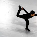 An athlete skating on the rink