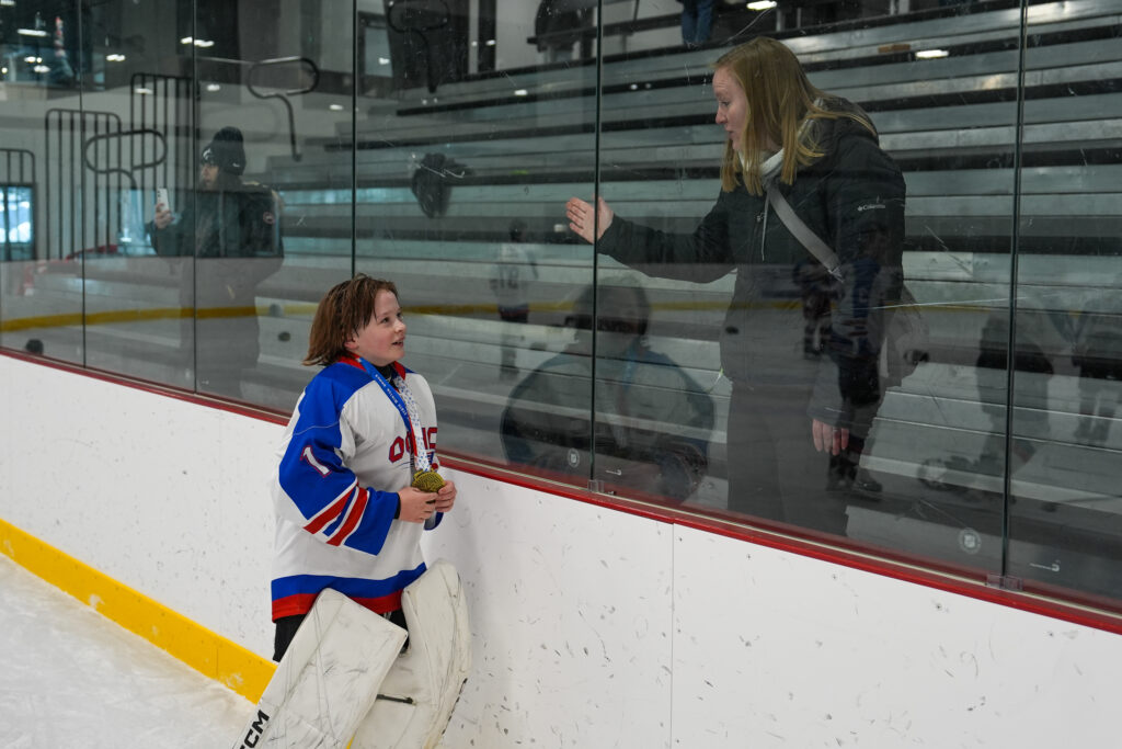 A group of athletes skating on the rink