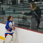 A group of athletes skating on the rink