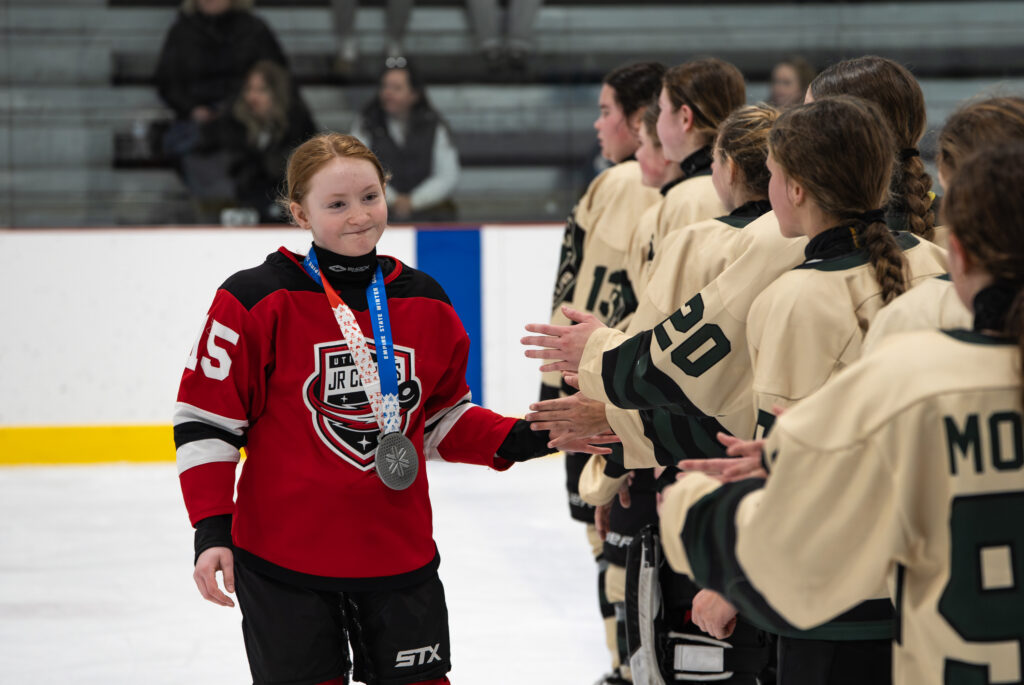 A group of athletes competing in athletic event sports