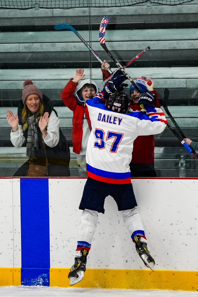 A group of athletes skating with helmet on the rink