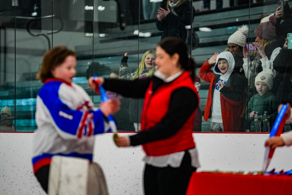 A group of athletes playing tennis on the court