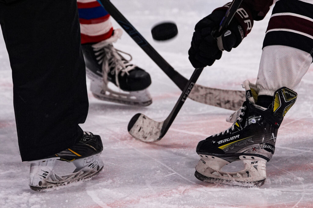 Two athletes skating on the rink