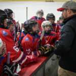 A group of athletes competing in athletic event sports with helmet
