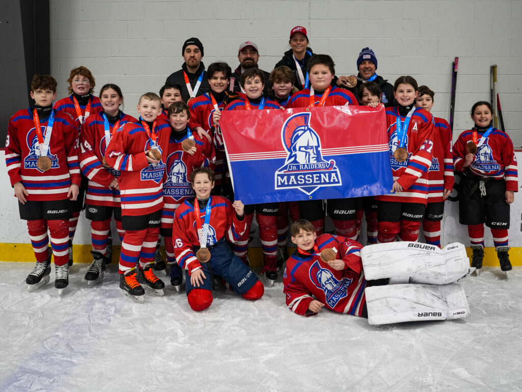 A group of athletes playing baseball on the field