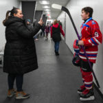 A group of athletes skating on the rink