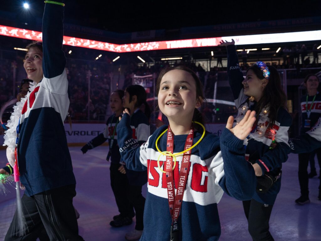 A group of athletes competing in athletic event sports