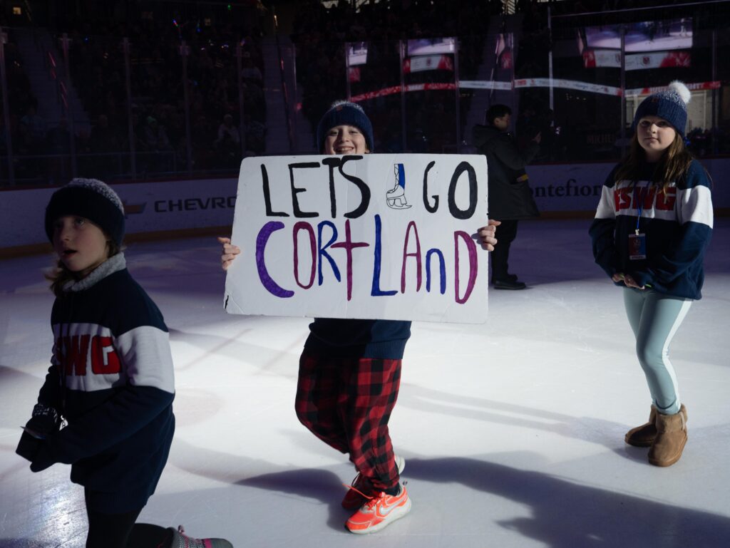 A group of athletes skating on the rink