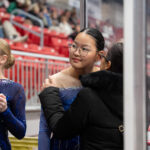 A group of athletes competing in athletic event sports