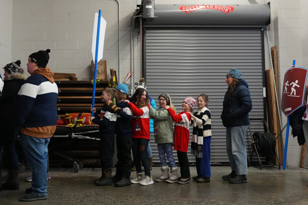 A group of athletes competing in athletic event sports