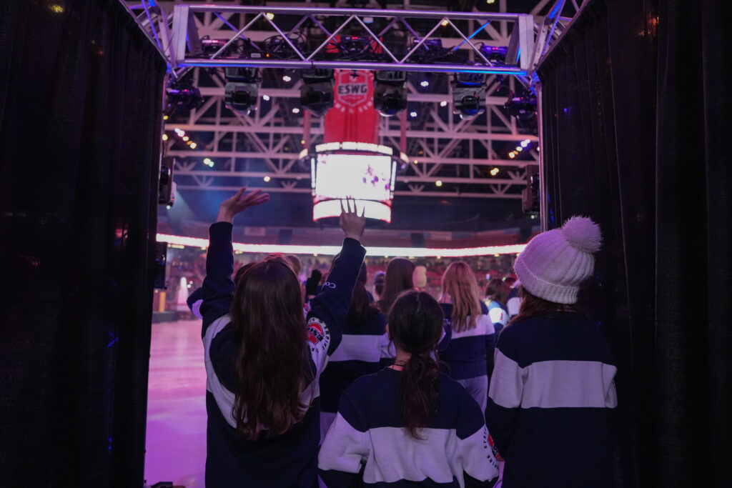 A group of athletes competing in athletic event sports