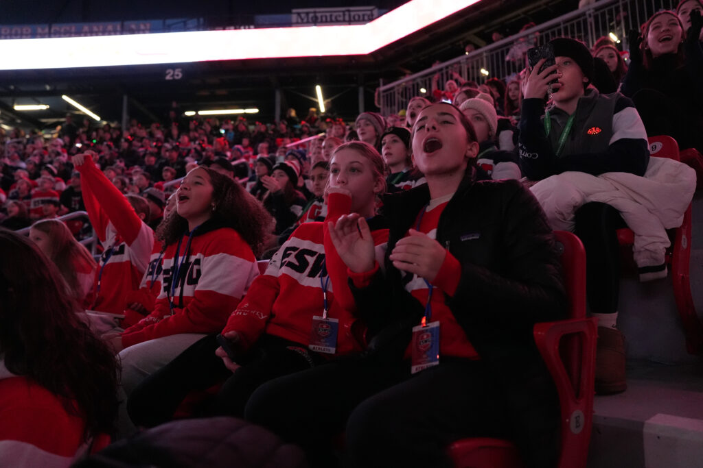 A group of athletes competing in athletic event sports