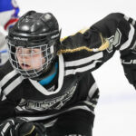 Two athletes competing in athletic event sports with helmet