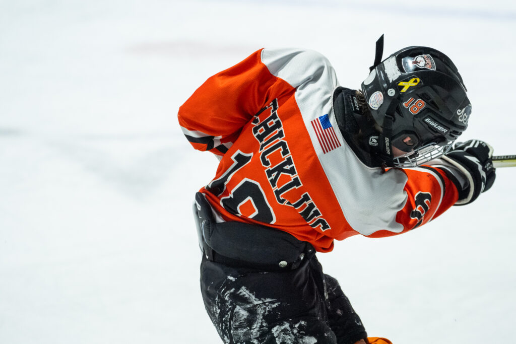 An athlete competing in athletic event sports with helmet