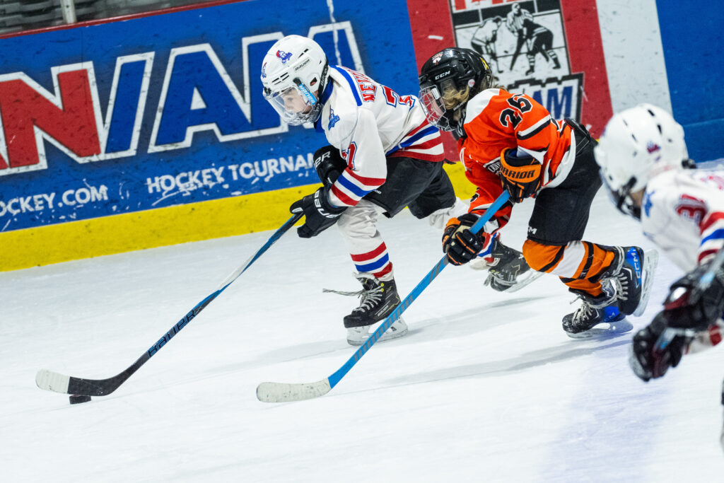 A group of athletes skating with helmet on the rink