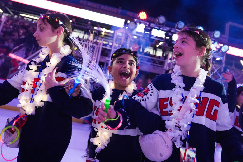 A group of athletes competing in athletic event sports