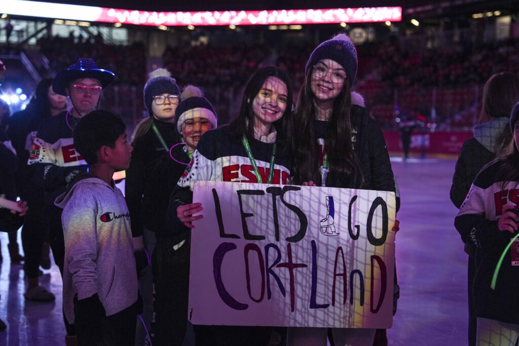 A group of athletes competing in athletic event sports