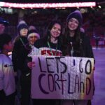 A group of athletes competing in athletic event sports