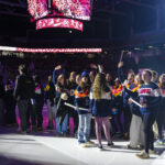 A group of athletes competing in athletic event sports