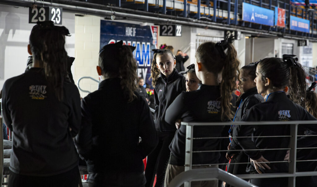 A group of athletes competing in athletic event sports