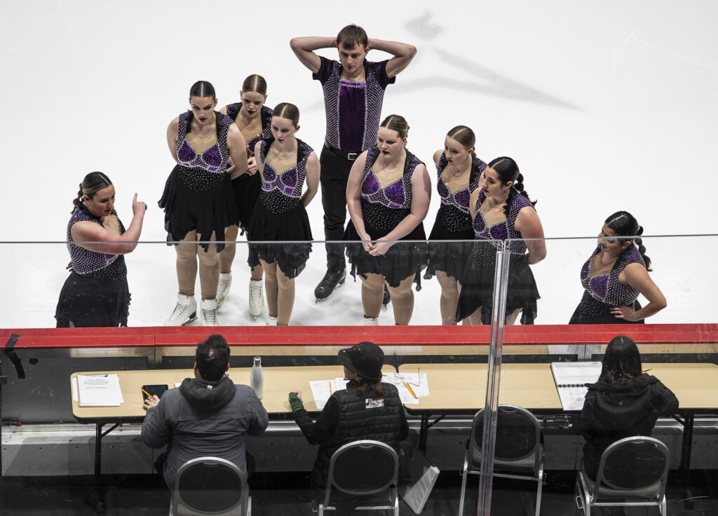 A group of athletes competing in athletic event sports