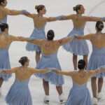 A group of athletes competing in athletic event sports