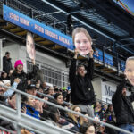 A group of athletes competing in athletic event sports