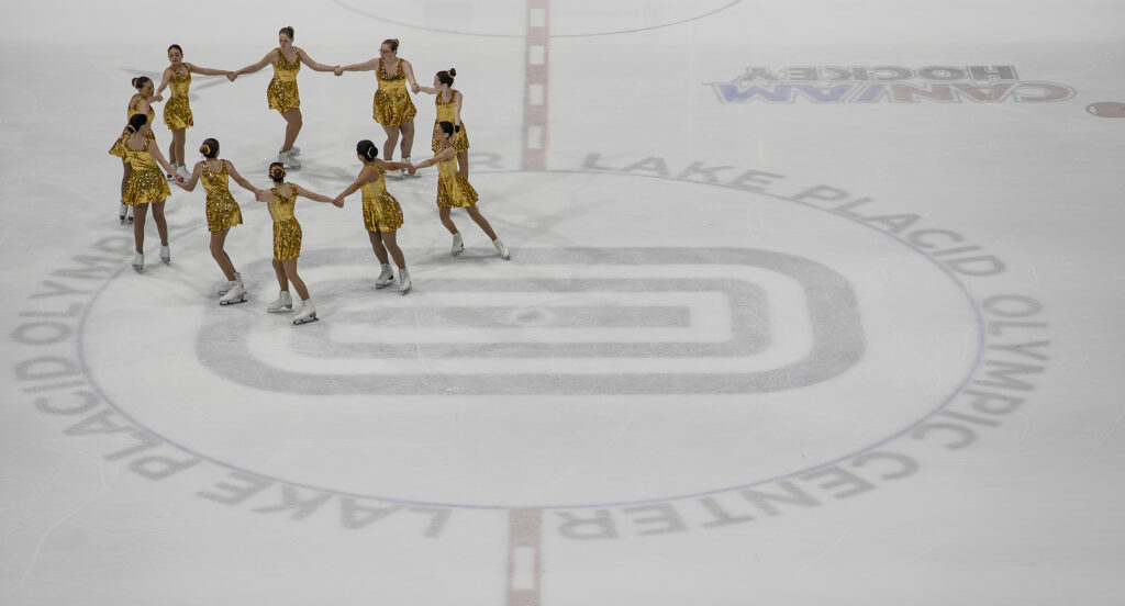 A group of athletes skating on the rink
