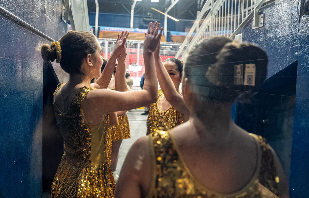 A group of athletes competing in athletic event sports