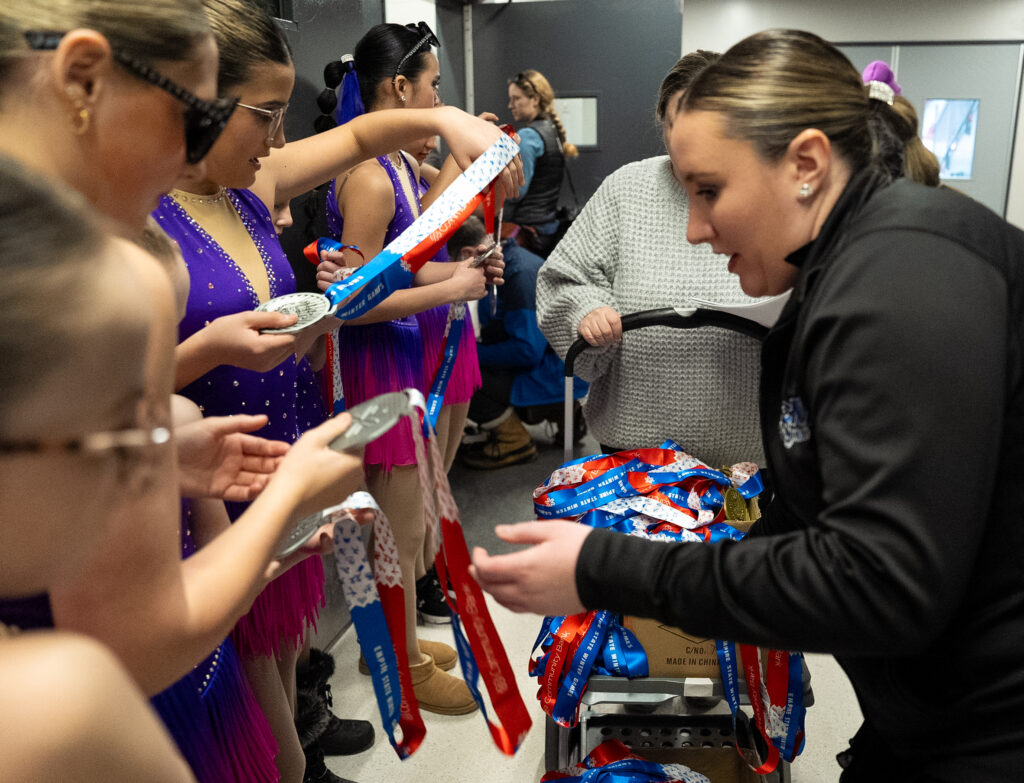A group of athletes competing in athletic event sports