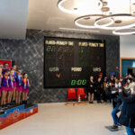 A group of athletes competing in athletic event sports