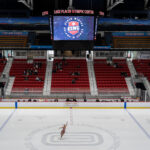 A group of athletes competing in athletic event sports