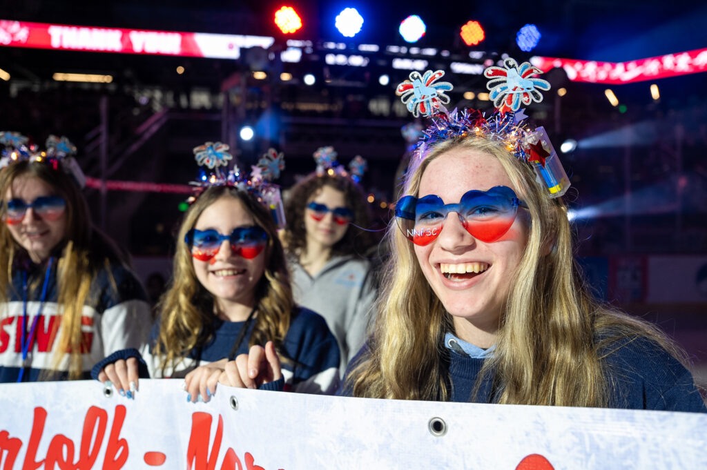 A group of athletes competing in athletic event sports