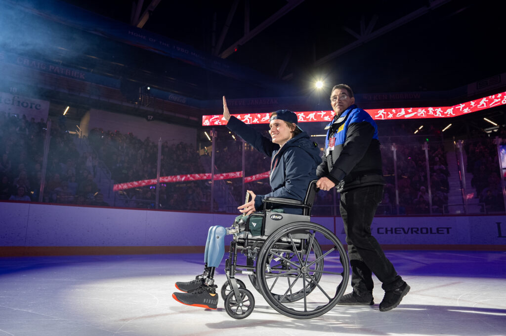 Two athletes skating on the rink