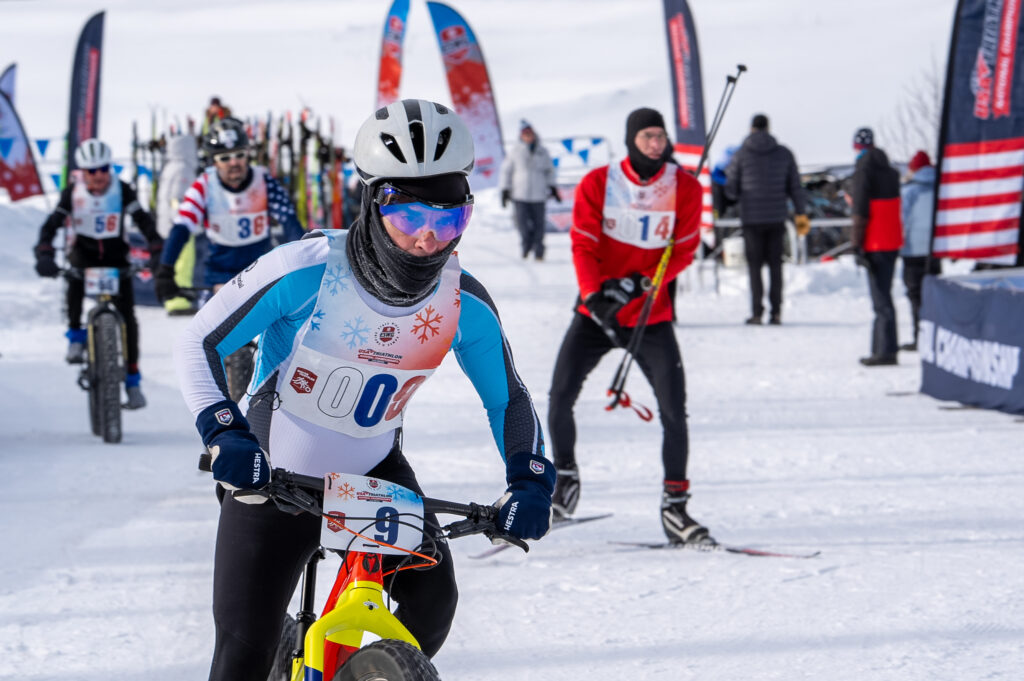 A group of athletes skiing with helmet in the snow