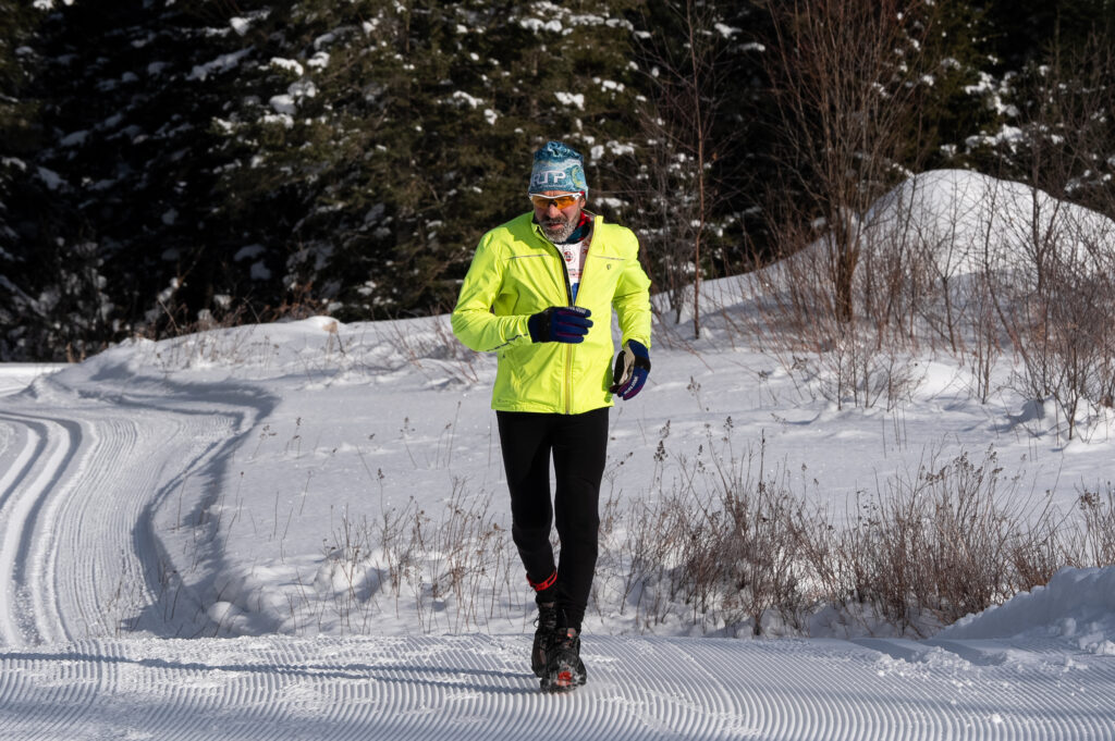An athlete running in the snow